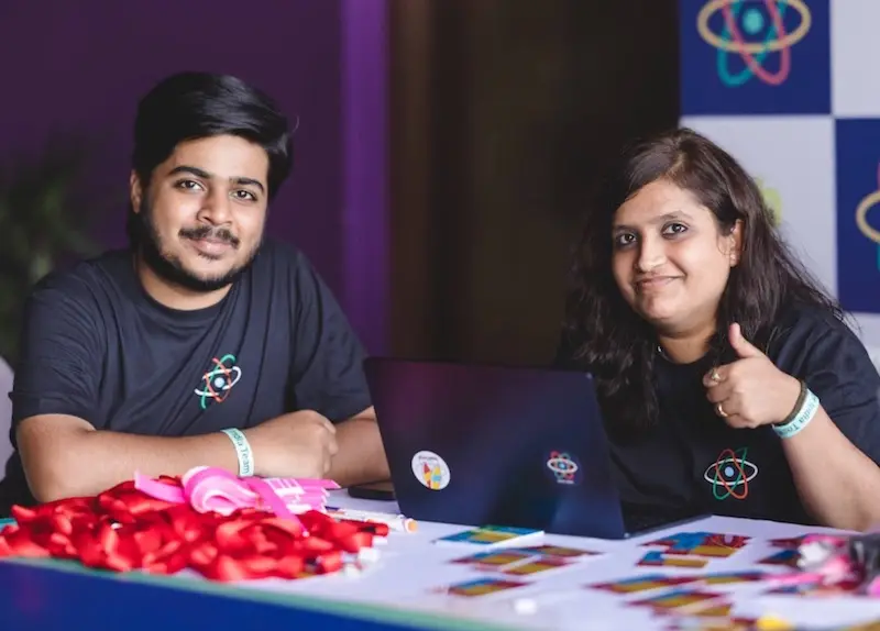 Organizers greeting attendees at React India